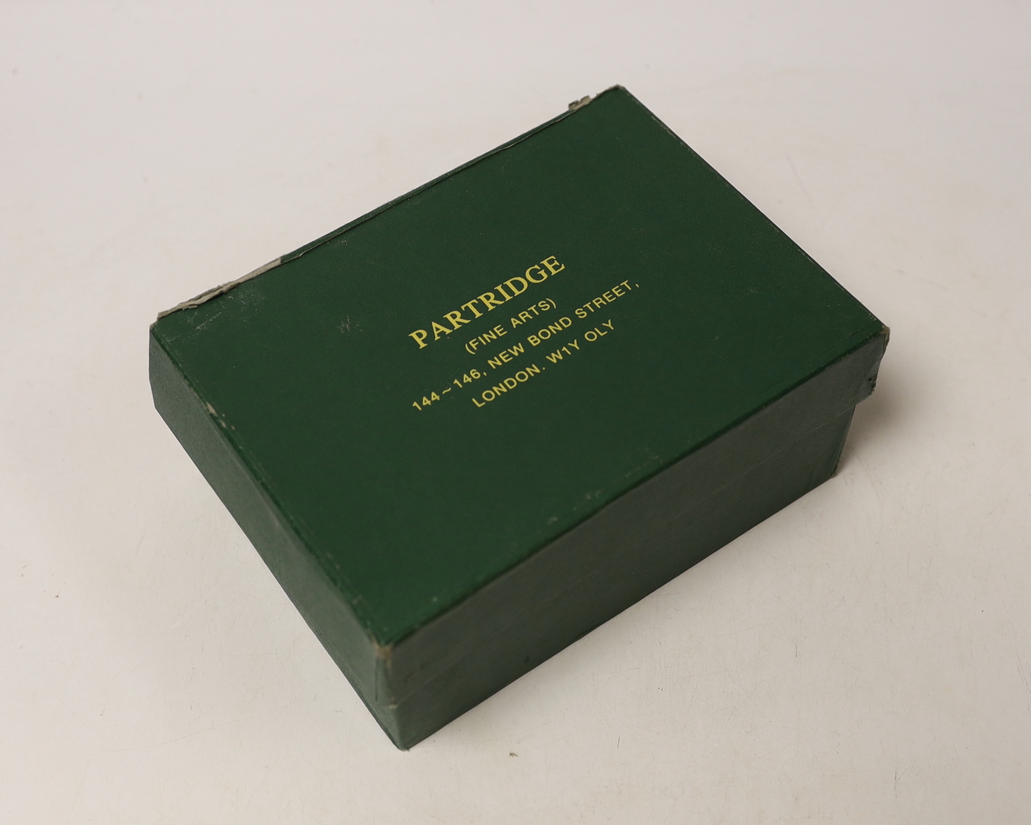 A boxed pair of George VI Britannia standard silver oval salts, Peter Guile Ltd, London, 1939, 8cm and a pair of late associated silver spoons.